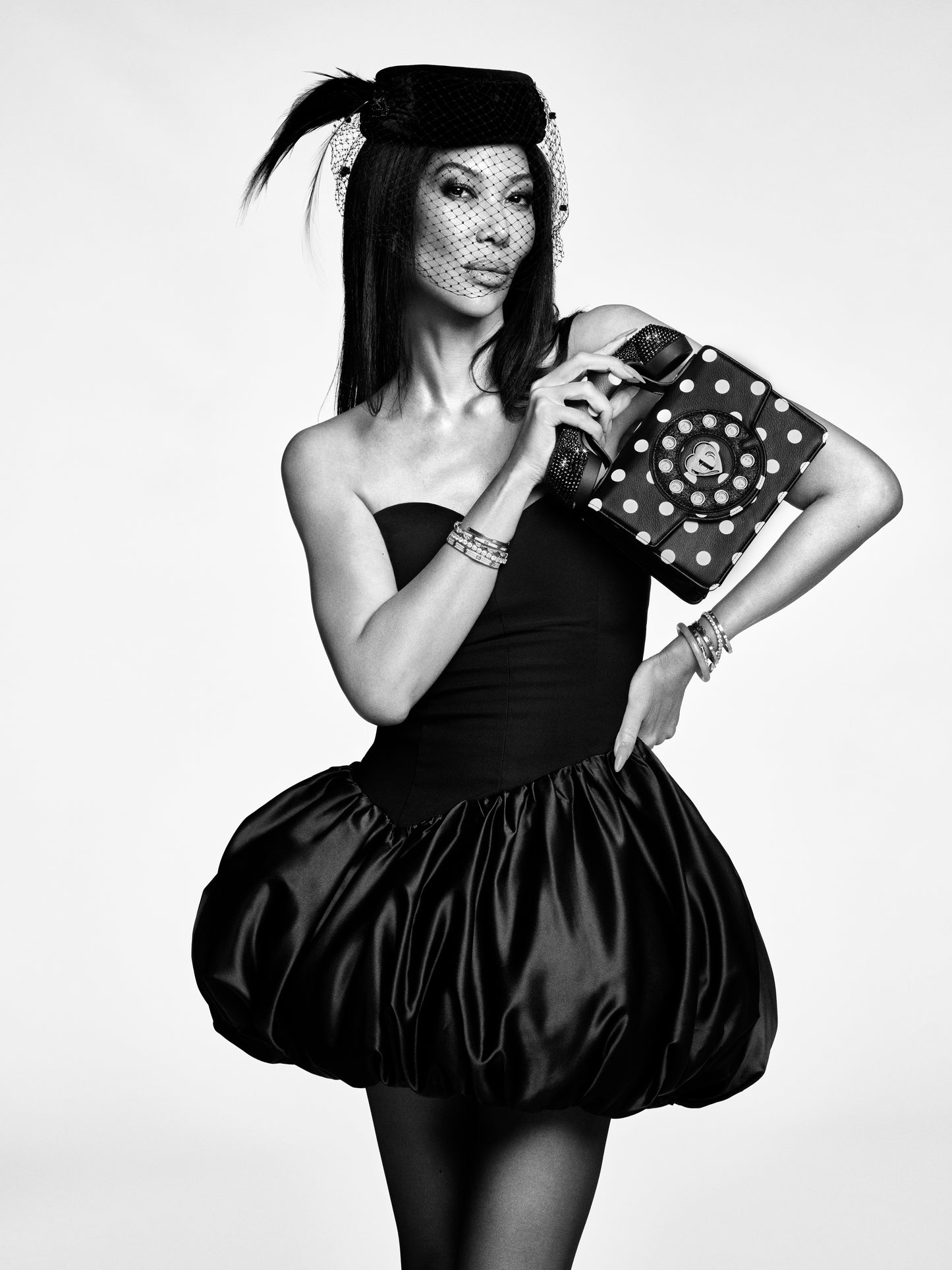 Kimora Lee with the Betsey Johnson Kitsch Miss Connection Phone Crossbody Bag Dots