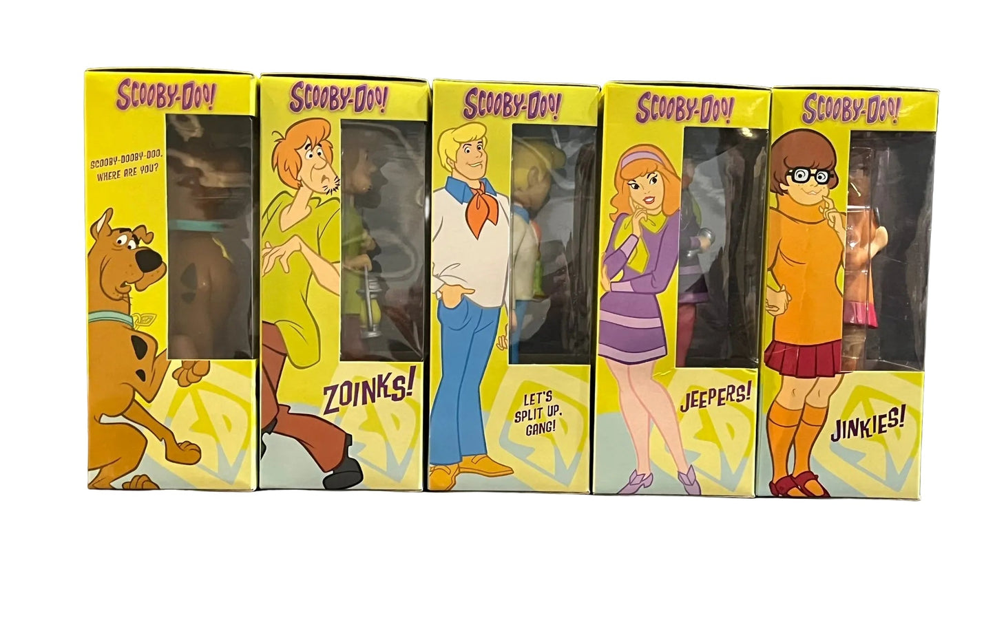 Set of Scooby-Doo figures in their packaging with character illustrations on a white background.