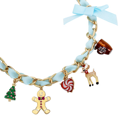 Bracelet with Christmas-themed charms on a white background