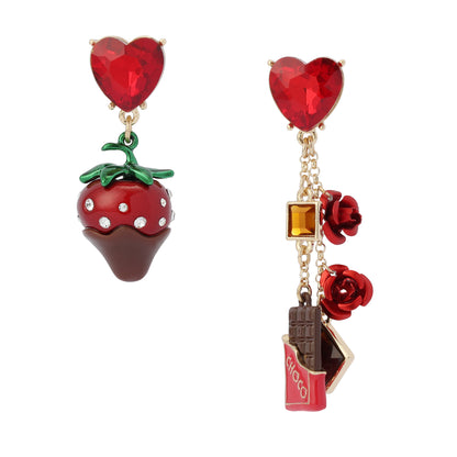 Earrings with strawberry, chocolate bar, and rose designs on a white background