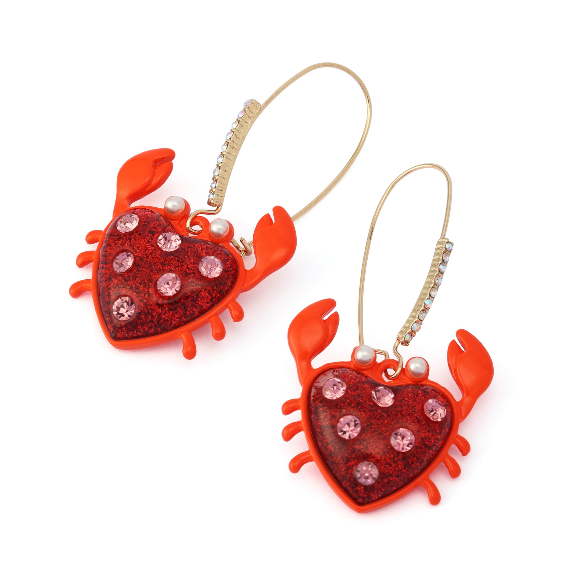 Pair of red crab-shaped earrings with heart details on a white background