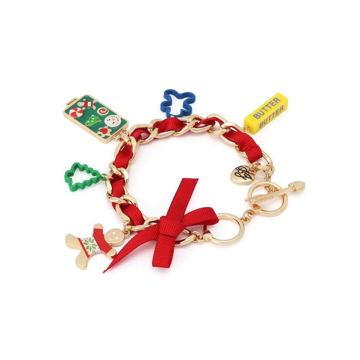 A gold-tone chain bracelet with a red ribbon bow and multiple Christmas-themed charms, including a green ornament, blue snowman, yellow 'BUTTER' tag, green tree, and gold stocking, on a white background.