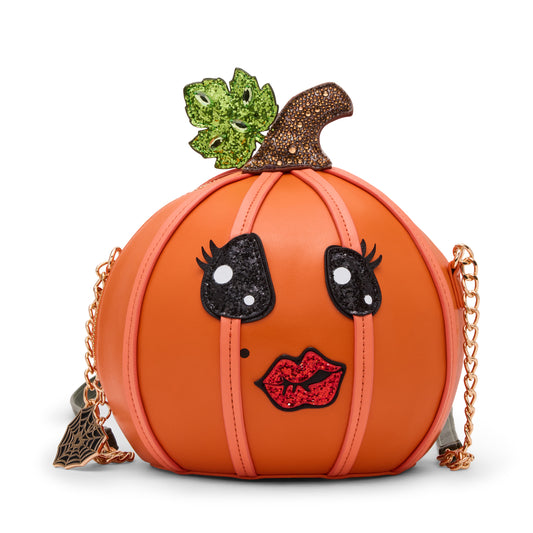 Pumpkin-shaped handbag with face details and chain strap on a white background