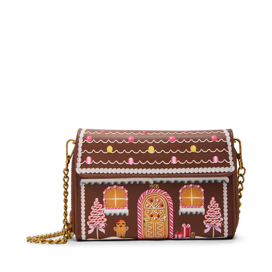 Gingerbread house-themed handbag with decorative elements on a white background