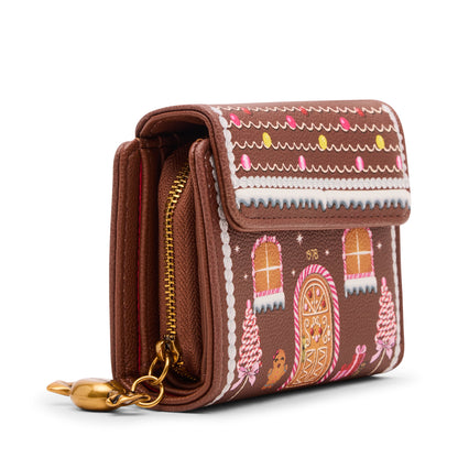 Brown wallet with colorful patterns and a gold charm on a white background