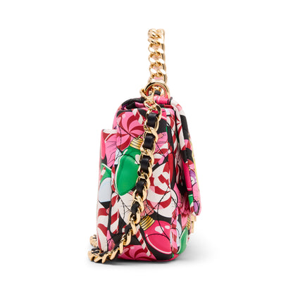 Colorful floral-patterned handbag with a gold chain strap on a white background
