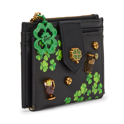 Black wallet with green shamrock designs and gold accents on a white background