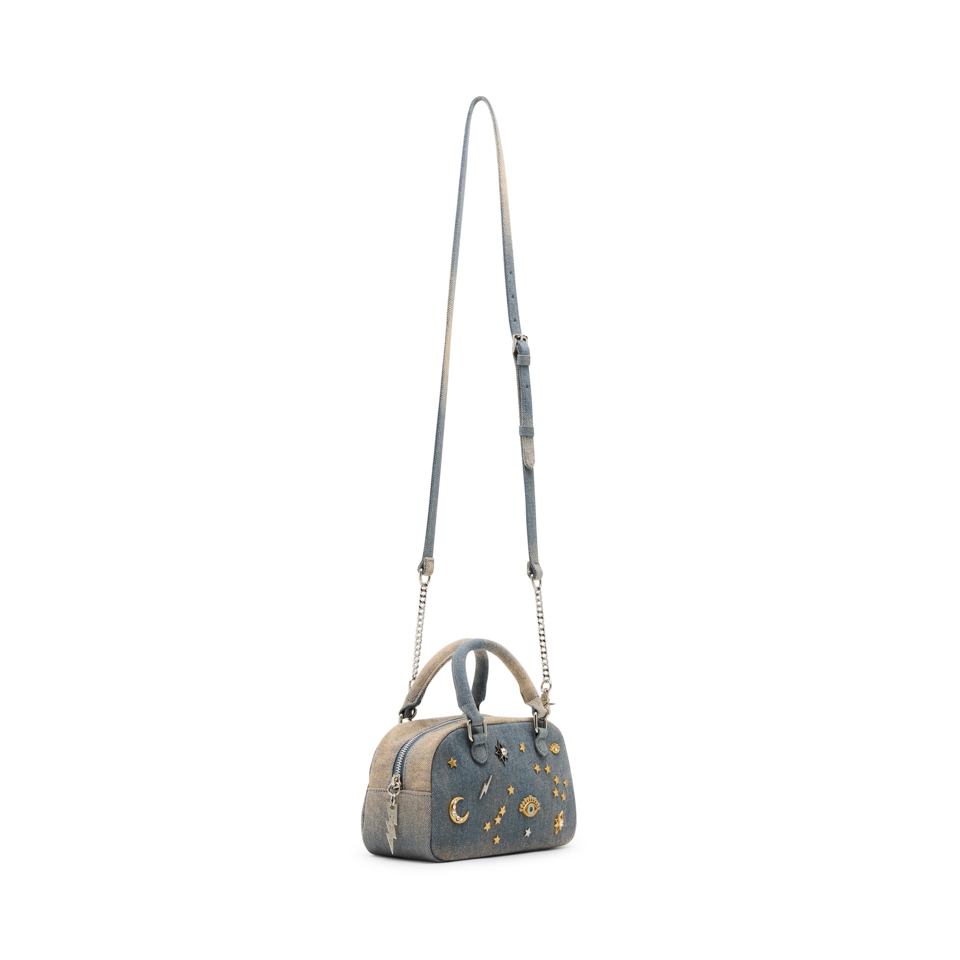 A small dome-shaped crossbody bag in distressed blue denim with gold-tone moon and star embellishments, featuring a top handle, chain strap, and zippered closure, shown against a plain white background.