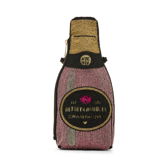 Bottle-shaped pouch with 'Betsey Bubbles Champagne' design on a white background