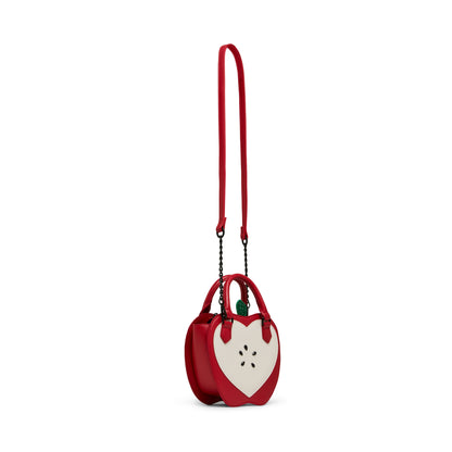 Red handbag with a heart design on a white background
