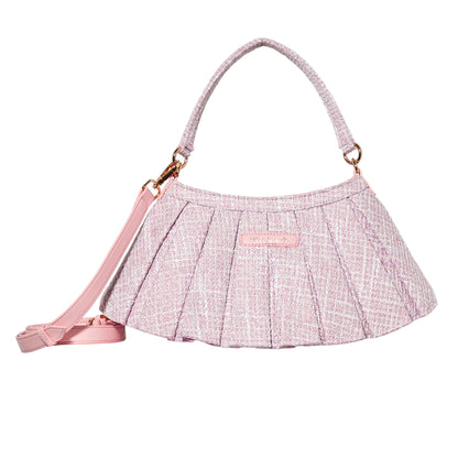 A light pink pleated handbag with a textured tweed-like pattern, featuring a top handle, a detachable shoulder strap, and gold-tone hardware on a plain white background.