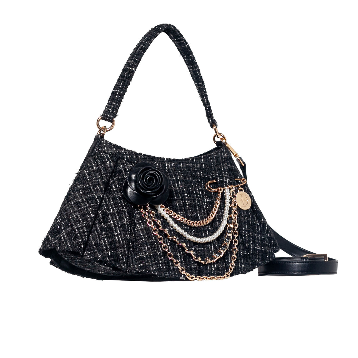 A black and gray tweed shoulder bag with a black fabric handle, gold-tone hardware, a black fabric rose embellishment, layered gold and silver chains, and a detachable black shoulder strap, shown on a plain white background.