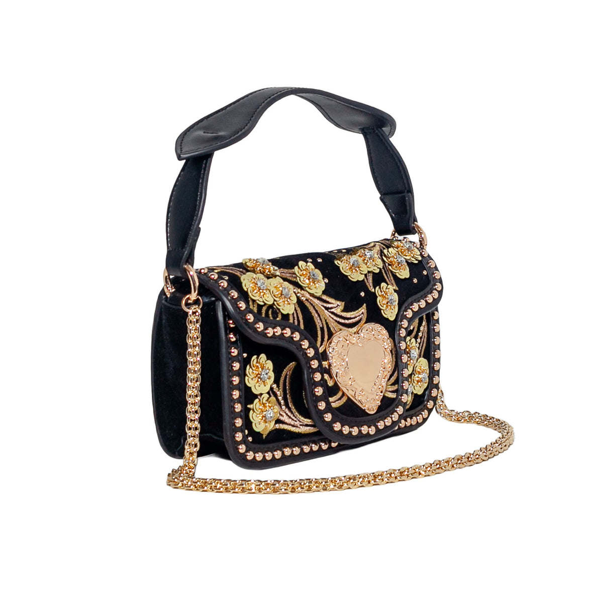 A black velvet shoulder bag with gold floral embroidery, a central gold heart motif, and gold rhinestone trim, featuring a black leather top handle and a gold chain strap, shown on a plain white background.