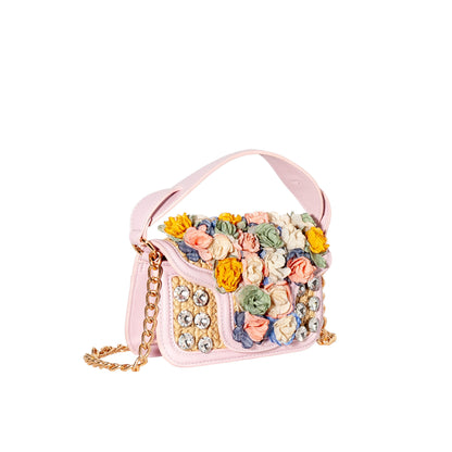 Pink handbag with floral design and chain strap on a white background