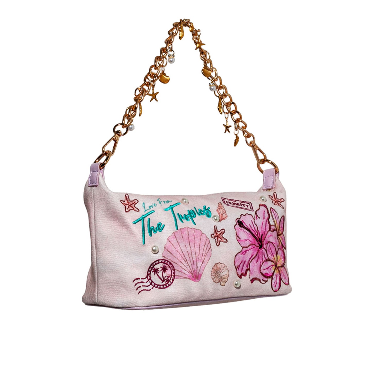 Handbag with floral and shell designs on a white background
