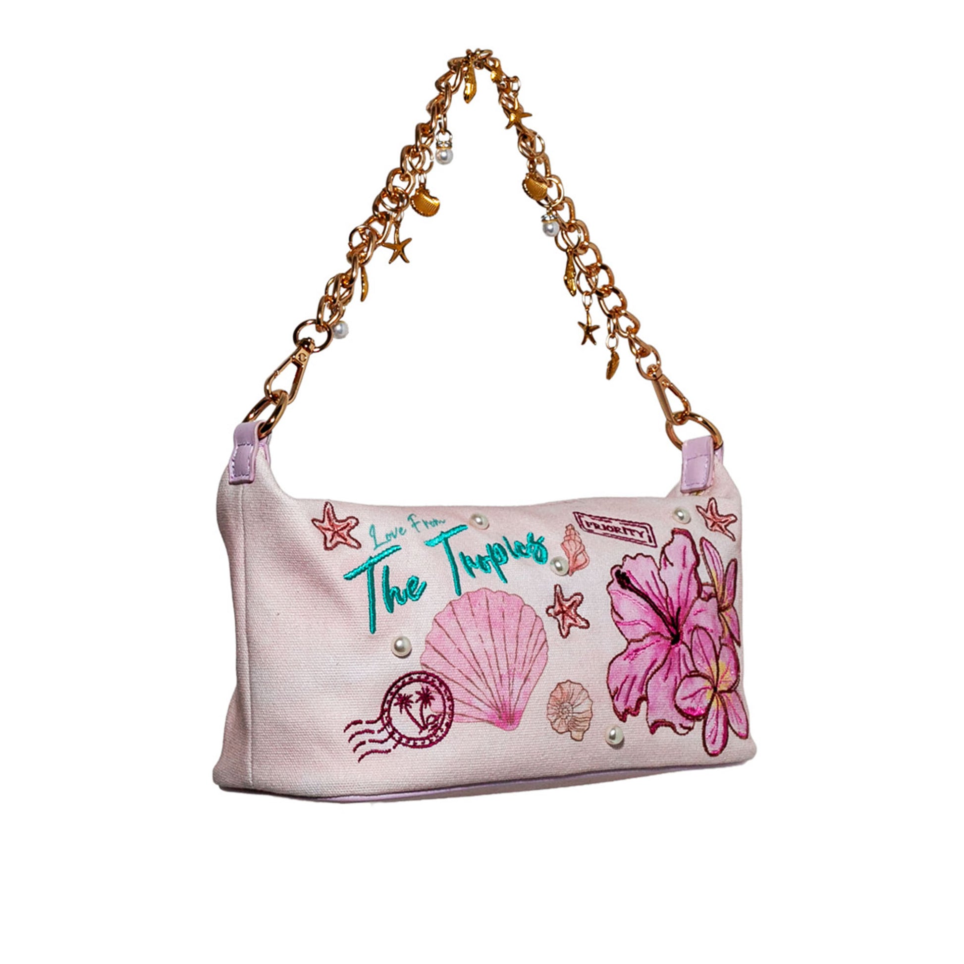 Handbag with floral and shell designs on a white background