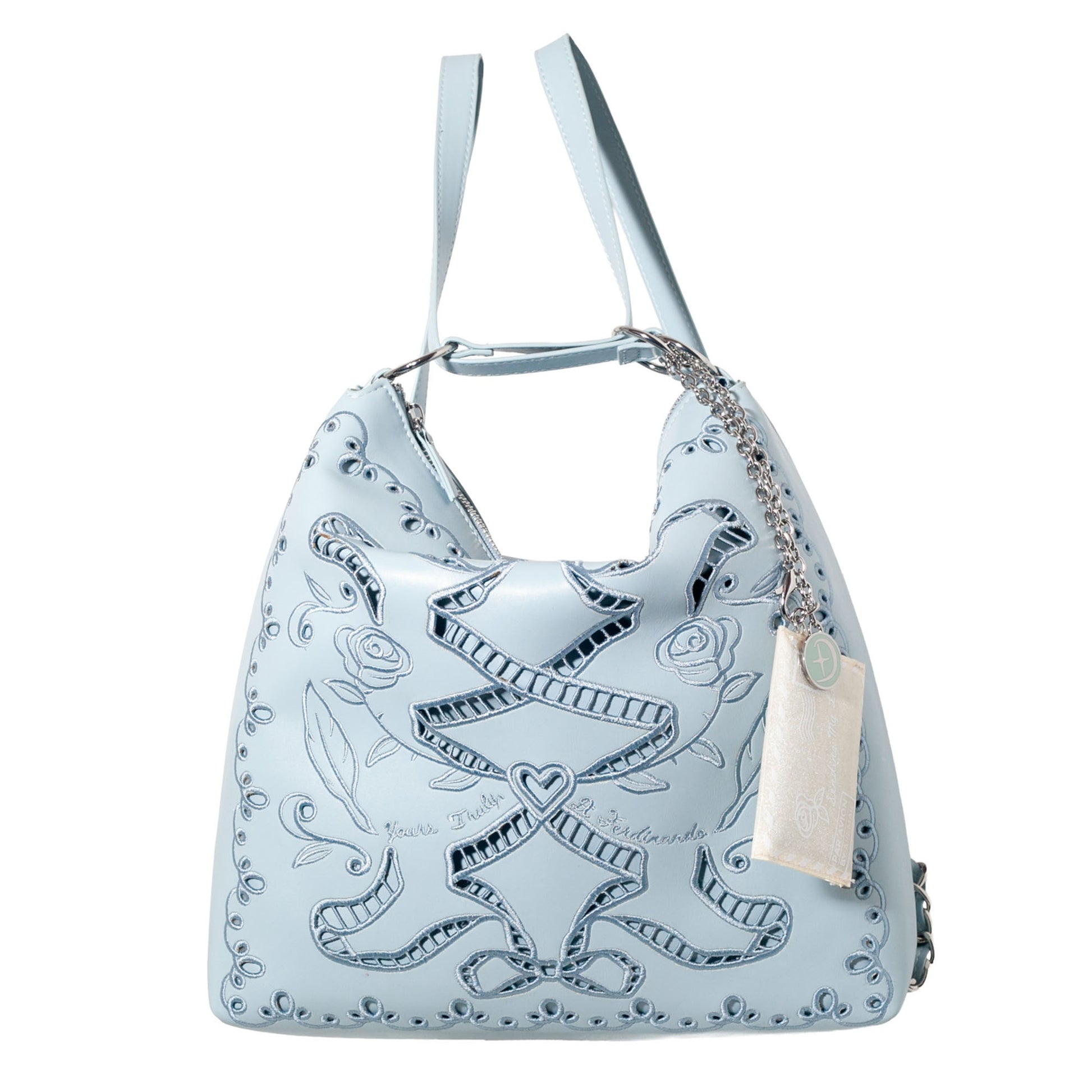 Light blue handbag with intricate designs on a white background