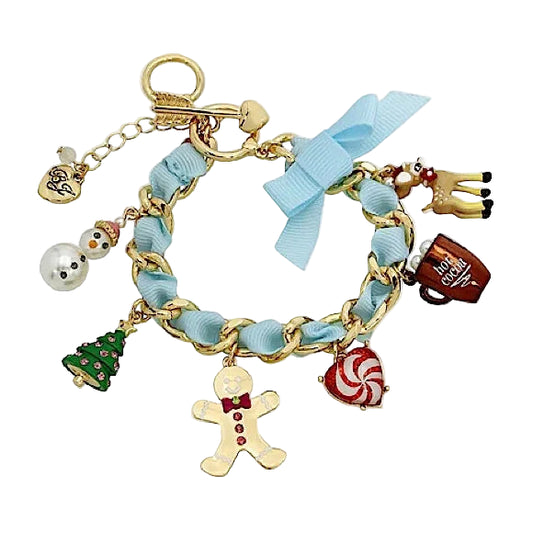 Bracelet with various charms including a gingerbread man, candy cane, and snowman on a light blue ribbon.